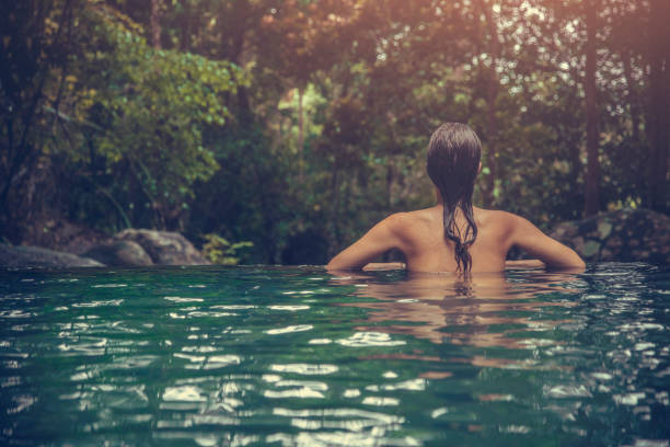 istock Woman in the swimming pool 975350060