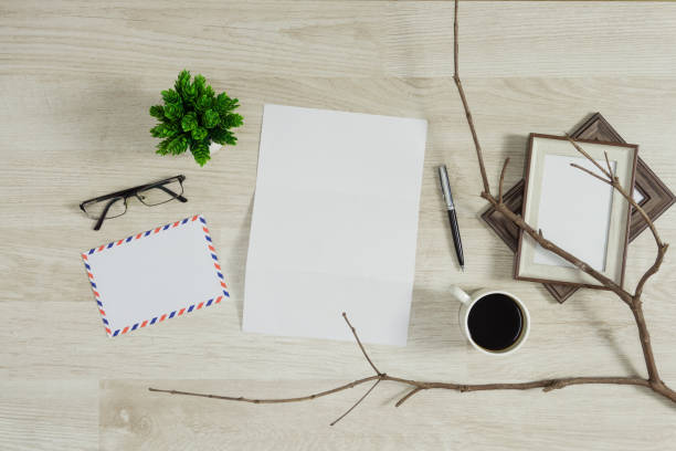 istock Letter paper with coffee on wood background. 975350088