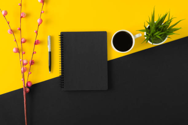 Sketch pad on yellow and black background.
