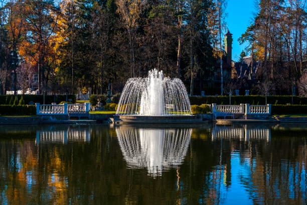 istock Fountain in the summer Park on the lake 975350324
