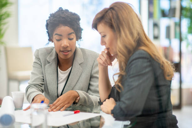 istock Businesswomen planning together 975354668