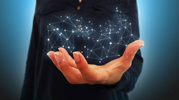 istock Businesswoman on blurred background holding hand flying network connection 975357040