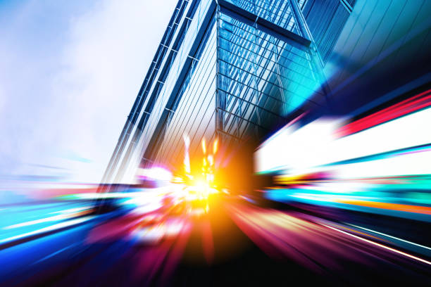 istock double exposure with traffic light and Modern office building 975385852