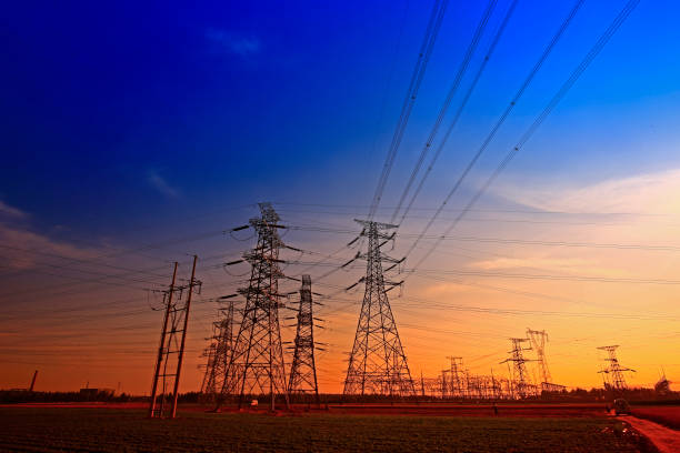 istock Electric tower, silhouette at sunset 975409158