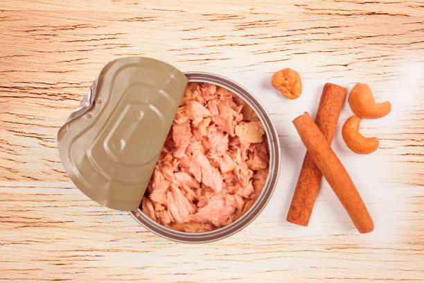 istock bowl of tuna chunks on wood table background. 975422880
