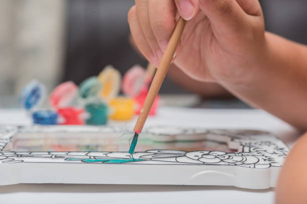 istock Children learn coloring and painting in classroom. 975428684