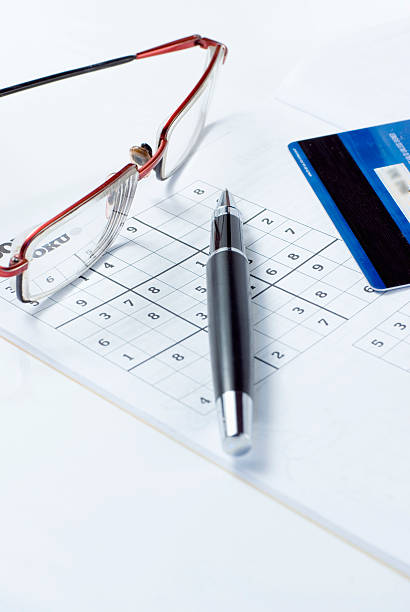 istock Online shopping and playing sudoku 97543983