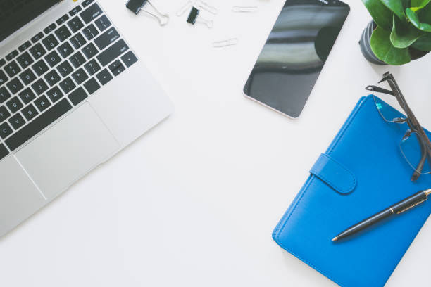 istock Top view of modern work space office desk 975440286