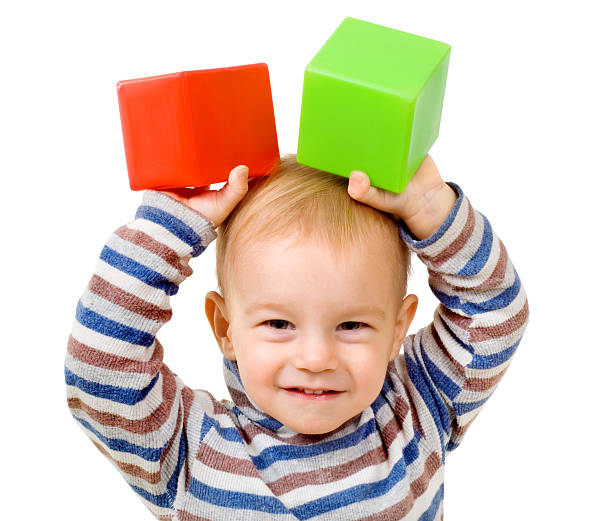 child with cubes stock photo