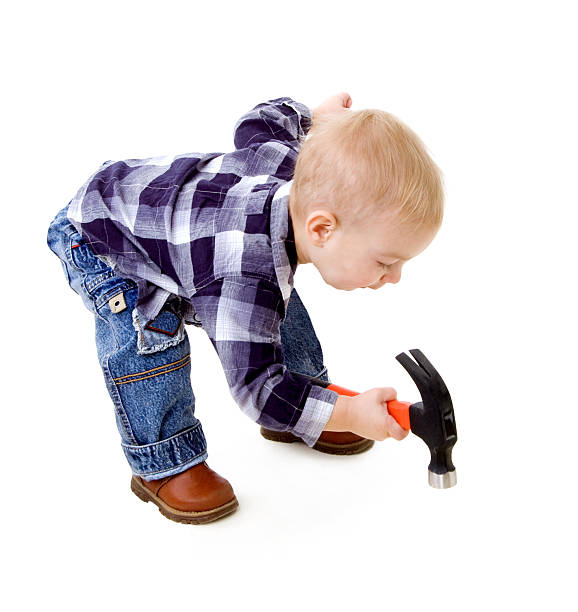 child with a hammer stock photo