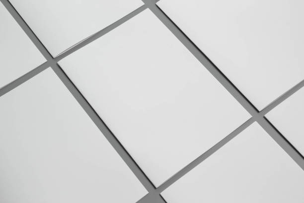 istock Blank portrait A4. brochure magazine isolated on gray, changeable background / white paper isolated on gray 975443998