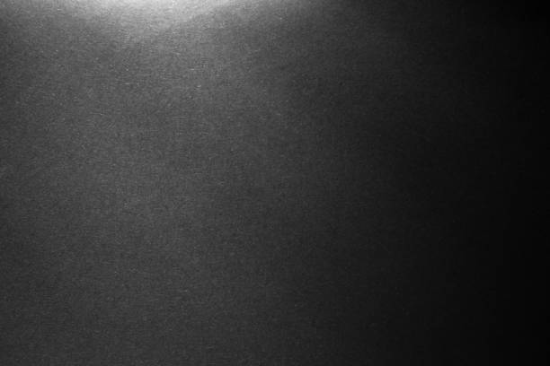 istock black paper texture or background with spotlight, dark wall backdrop wallpaper, dark tone. 975463320