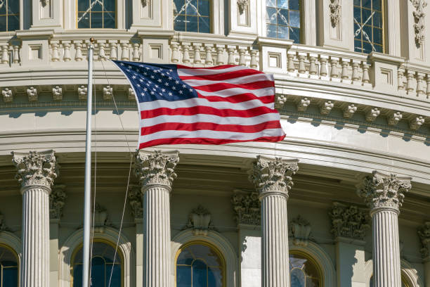 istock Washington DC Capitol detail with american flag 975466304