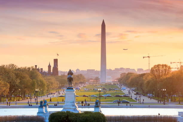 Washington DC city view at a orange sunset, including Washington Washington DC city view at a orange sunset, including Washington Monument from Capitol building monument stock pictures, royalty-free photos & images