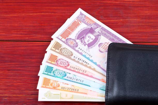 istock Money from Mongolia in the black wallet 975505768