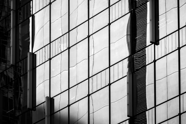 istock Modern office building detail, glass surface with B&W color 975507850