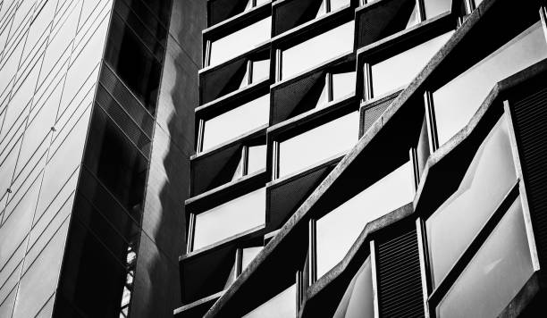 istock Modern office building detail, glass surface with B&W color 975507854