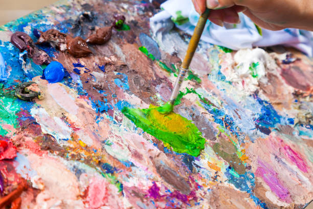 istock Close up oil paints on the palette 975512238
