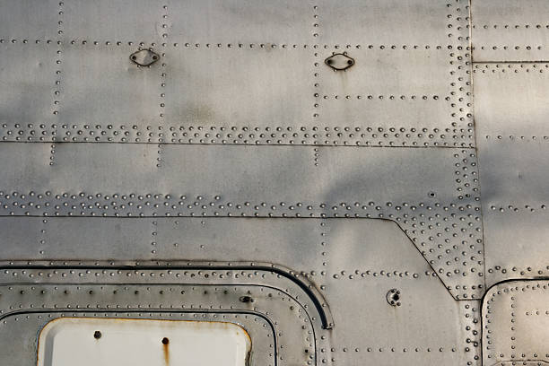 istock Aluminum trailer close-up showing grime and rusted studs 97551486