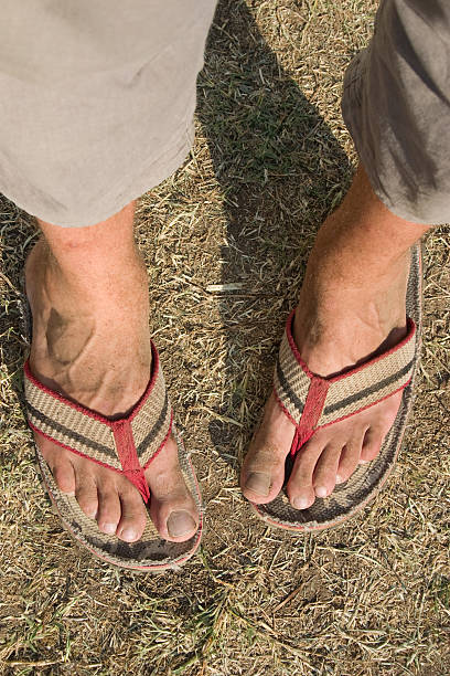 istock Dirty legs in flipflops 97551540