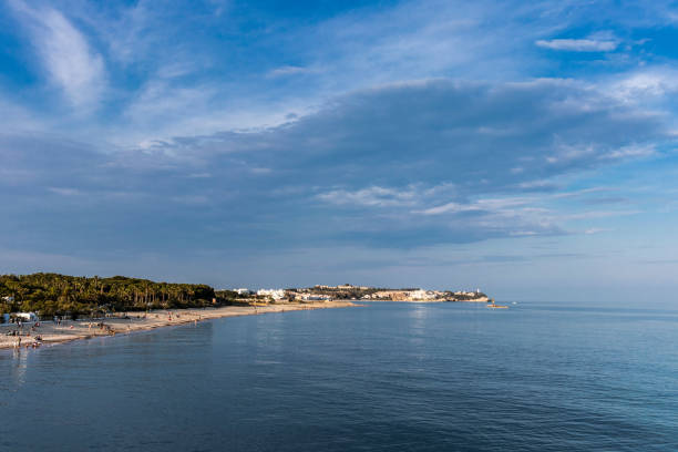 istock Coastal mediterranean blue landscape with quiet water on a sunny day 975524008