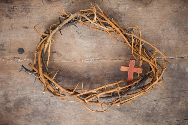 istock wood texture background with crown thorns 975530324