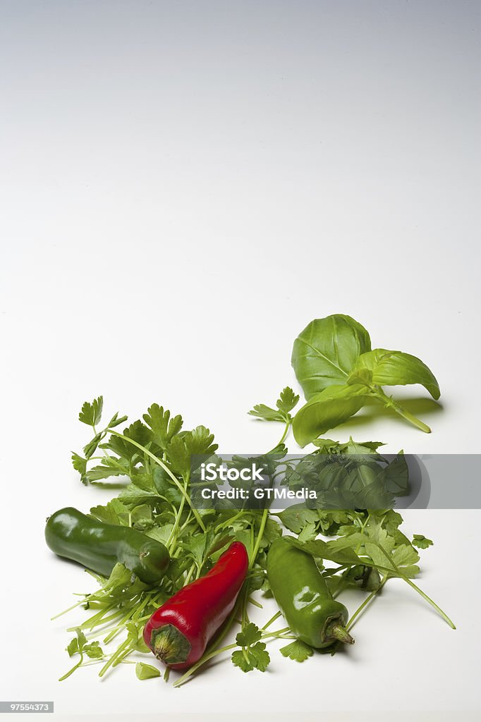 Red and Green Chillies with Parsley Basil  Burning Stock Photo