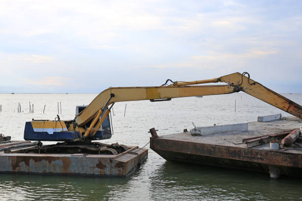istock Excavator working in the sea. 975555126