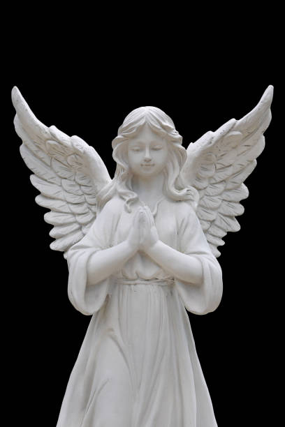 istock Angel statues isolated on black background. 975561152