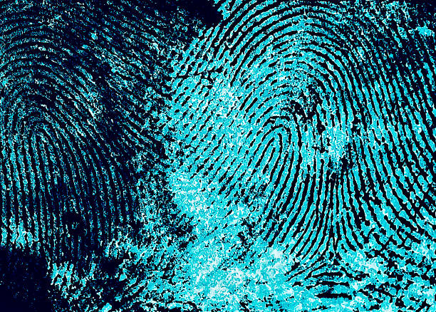istock Fingerprint with ultraviolet lamp. Fingerprint as background. 975565496