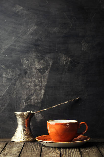 istock cup of coffee and old coffee pot 975565684