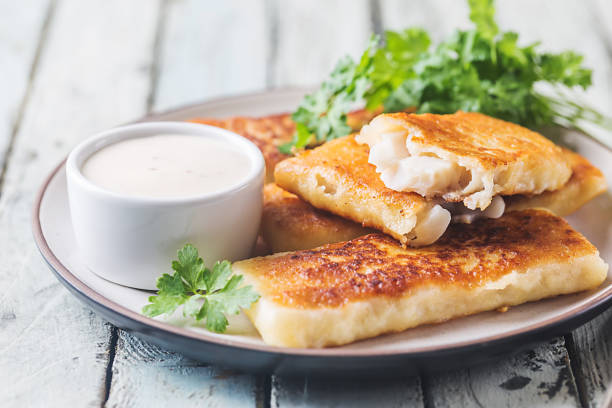 istock Golden fried fish fingers 975565944