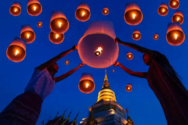 Photo of Thai people floating lamp in Yee Peng festival.