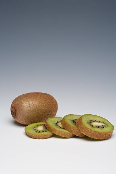 Kiwi Fruit whole and sliced stock photo