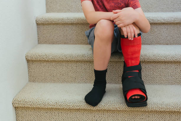 istock Boy injured foot in cast 975583906