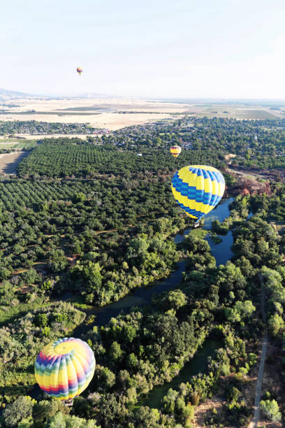 istock colorful hot -air ballooning over a creek 975584404