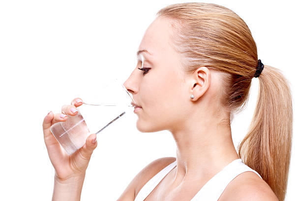 istock beautiful woman drinking water 97558659