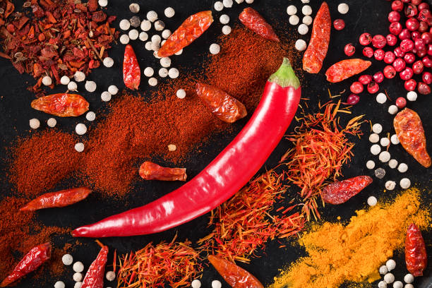istock Spicy background with Fresh Chili pepper. Top view 975589588