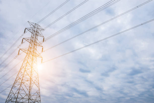 istock Electricity concept. Close up high voltage power lines station. 975589942