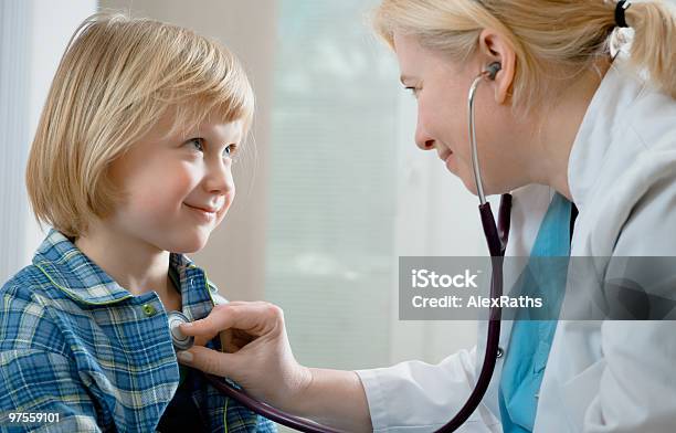 Medical Doctor Examining A Young Blonde Girl Stock Photo - Download Image Now - Adult, Beautiful People, Beautiful Woman