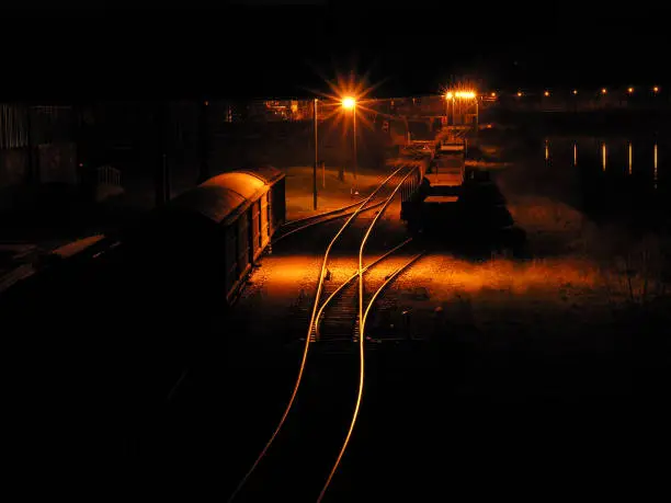 Freight station with parked wagon at night