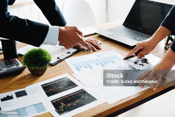 Group Of Businesspeople Discussing The Charts And Graphsbusinessmen Discussing On Stockmarket Document In Officebusiness Partners Consult Documents At Meetingconcept Of Brainstorm Teamwork Planning Stock Photo - Download Image Now