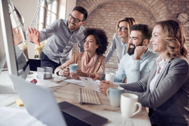 istock Business team sitting in office and planning work 975599640