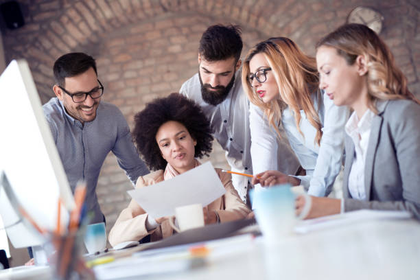 istock Business team sitting in office and planning work 975599746