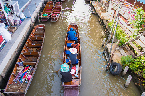 Ratchaburi,Thailand - June, 02, 2018 : Unidentified name tourists njoy traveling on a boat tour to Damnoen Saduak floating market Ratchaburi, Thailand.