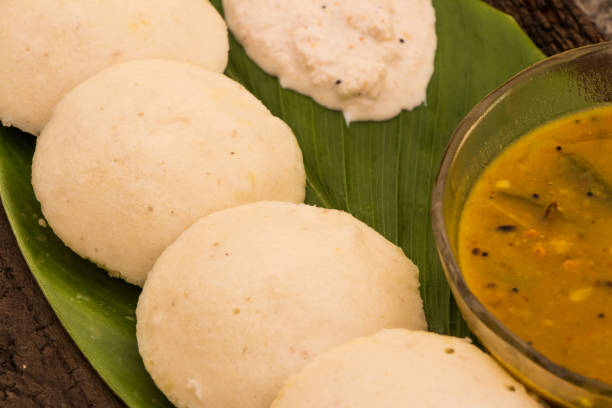 istock idli with coconut chutney and sambhar bowl placed on green leaf 975602228