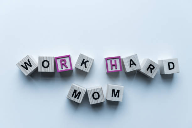 istock top view of wooden cubes with words Work Hard Mom on blue table 975602552