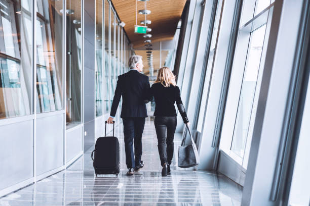 istock Business partners walking at the airport 975605768