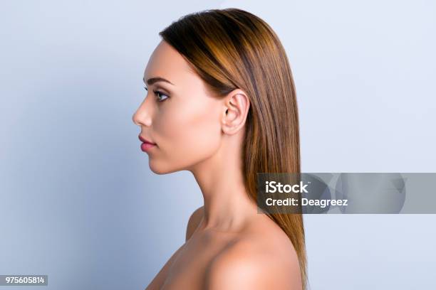 Trend Dermatology Purity Medicine Lotion Ear Rhinoplasty Nose Wellness Concept Profile Portrait Of Beautiful Woman With Ideal Smooth Nourished Hairdo Isolated Gray Background Stock Photo - Download Image Now