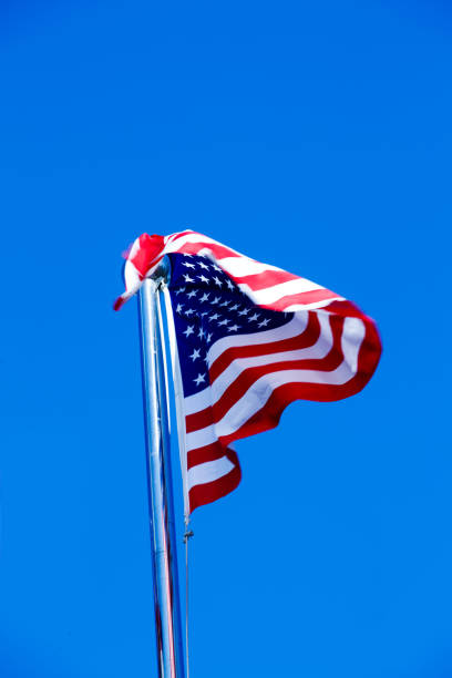 istock American Flag Blowing in the Wind 975608554